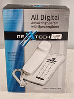 Front of box showing NextTech digital answering system with speakerphone model.