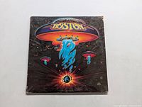 Front cover of Boston self-titled vinyl LP showing the iconic spaceship artwork with the band name.