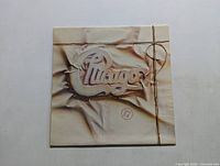 Front cover of Chicago 17 vinyl LP record album showing embossed logo and design resembling a wrapped package.