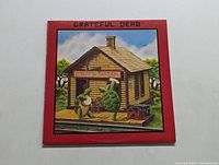 Front cover of Grateful Dead Terrapin Station album, showing cartoon frog and turtle at a train station with 'Terrapin Station' sign.
