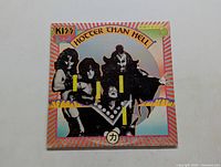 Front cover of Kiss Hotter Than Hell vinyl LP showing band members and album title