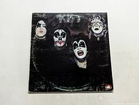 Front cover of Kiss debut studio album showing the band members in face paint.
