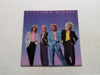 Front cover of the Platinum Blonde 'Alien Shores' LP album showing band members in 1980s attire.