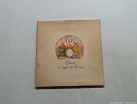 Front cover of Queen 'A Night at the Opera' vinyl LP showing artwork and title.