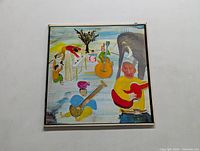 Front cover of LP with colorful painting featuring musicians and an elephant.