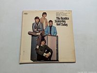 Front cover of The Beatles LP album 'Yesterday and Today' showing the band members posing and the album title.