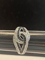 Top-down view of the .925 silver ring featuring black and clear Swarovski crystals in a twist cluster design.