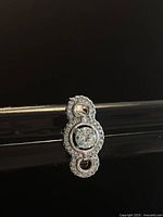 Top view of 925 silver Swarovski ring showing central round crystal surrounded by smaller cluster crystals in a linked circle pattern.