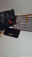 Group shot of all three bags: Guess tote, Stella & Dot canvas handbag, Banana Republic clutch