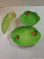 Overview of three green ceramic plates
