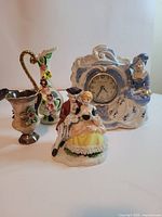 Group shot of all four ceramic and porcelain pieces