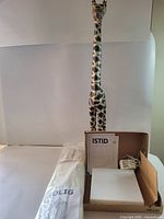 Entire lot showing giraffe, Istid lamp boxed, Solig net sealed