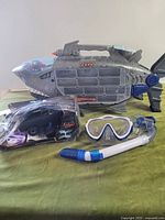 All three items together: shark transporter, R/C car in box, snorkel set