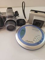 All three items together: Sony camera, vintage camera, Panasonic CD player