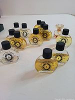 Front view of numbered imitation perfume oil bottles and miniature flacon