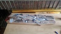 Overview of rustic wood painting showing all painted ducks and wood texture