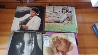 Photo showing top stack of vinyl records including Michael Jackson's Thriller and other classic albums
