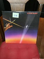 Front cover of Supertramp Famous Last Words LP album showing artwork with hand and tightrope walker