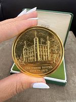 Obverse view of the antique medallion showing the White Tower with dates 1078-1978