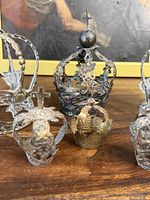 Close-up of medium dark-patina crown and small brass/gilt crown front view