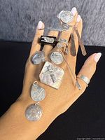 Overview of all 13 pieces arranged on a hand model