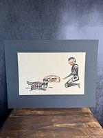 Full frontal view of the "Loons Necklace" print in black and red formline style, mounted on black mat board.