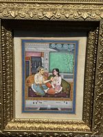 Frontal view of original painting showing subjects and ornate gold frame.