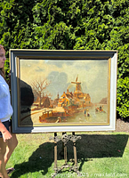 Full view of framed painting on outdoor stand showing overall composition and condition