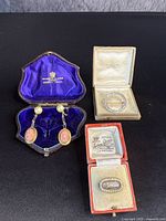 Overview of all three jewelry pieces in their boxes