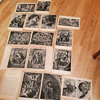 Overhead view of 13 double-sided Michelangelo art prints laid out on a wooden floor, showing a variety of Renaissance images including sculptures, frescoes and detailed portraits.