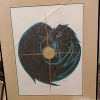 Full view of framed artwork showing black raven and gold sun design, glass cracked in frame.