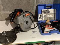 Black & Decker circular saw and Weller soldering kit in blue case with tools and manuals