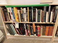 Shelf of assorted hardcover and paperback books