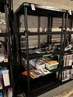 Front angle of the shelf showing three tiers with items stored but not included.