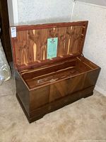 Open cedar lined chest with visible cedar interior and cedar drawer, showing wood grain details.