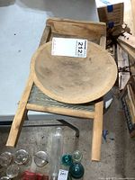 Washboard and wooden bowl showing overall condition and size comparison with other glass items on table.