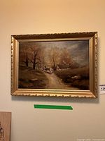 Wide view of entire framed oil painting showing the woodland scene with horse and cart and cottage.