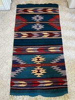 Full-view of the rug laid flat showing overall size, pattern and color scheme