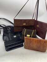 Front and side view of all six bags grouped together on white background to show variety and condition