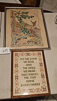 Photo showing both framed needlepoints side by side, capturing size and details of the deer forest scene and the framed inspirational quote
