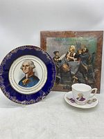 Full view of George Washington plate, tea cup and saucer, vinyl record album.
