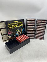 Photo of the Smithsonian Collection of Classic Jazz cassette box set with multiple cassettes displayed alongside the black storage tray.