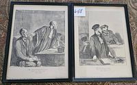 Two framed black-and-white Daumier lithograph prints side by side, showing courtroom scenes, labeled with seller lot number.
