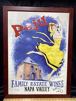 Framed Peju Family Estate Wines Napa Valley poster with dancing woman and winery building illustration.