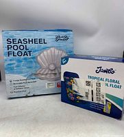 Two Jambo pool float boxes side by side, Seasheel design and Tropical Floral design.