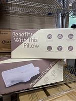 Boxes of Sliffi memory foam pillows highlighting pillow benefits and design.