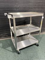 Full front view of 3 tier rolling cart showing all shelves and wheels