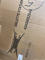 Cardboard box packaging showing branding of Regency Tables and Sinks and model information for omelette station.