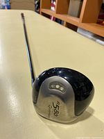 Front angle of the TaylorMade R580 golf driver head showing the titanium face and markings.