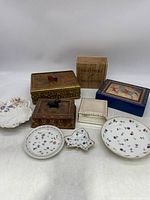 Overall grouping of various trinket boxes and decorative dishes with different materials and designs